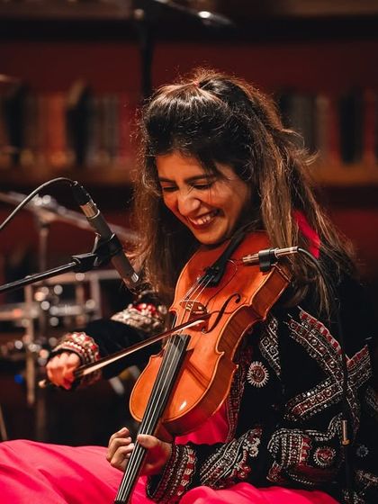 The wonderful Apoorva Krishna, whose violin sings with so much emotion. Her smile here captures the joy we all feel when the music is flowing perfectly.
