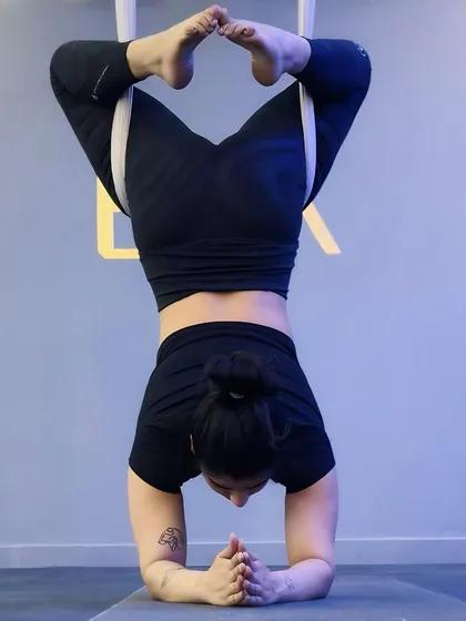 It's more than just a cool-looking workout. Aerial yoga offers real benefits like decompressing your spine, improving body awareness, and building incredible core strength, often feeling easier than classic yoga.