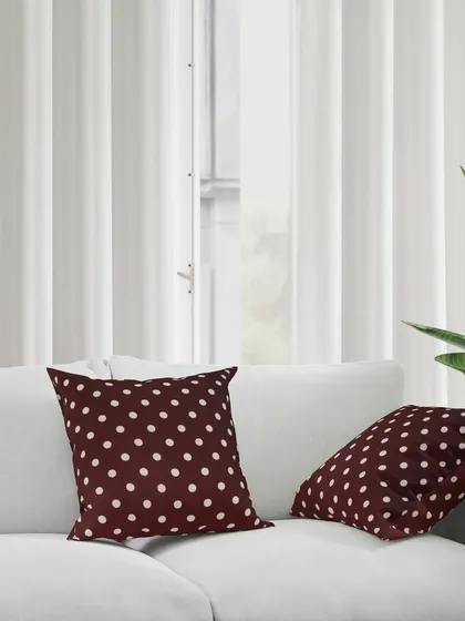 A lifestyle shot of our polka dot cushions on a sofa, creating a cozy and inviting home scene. We create aspirational images that sell a lifestyle, not just a product.