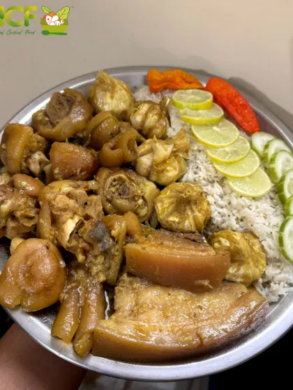 A succulent plateful of boiled pork ribs and trotters, served with rice and fresh lemon and cucumber.