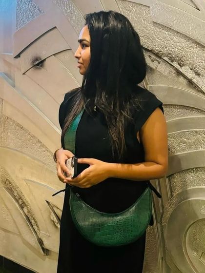 The Selena in a classic Forest Green croc print. This customer's styling shows how it can be the perfect finishing touch to a monochrome outfit.