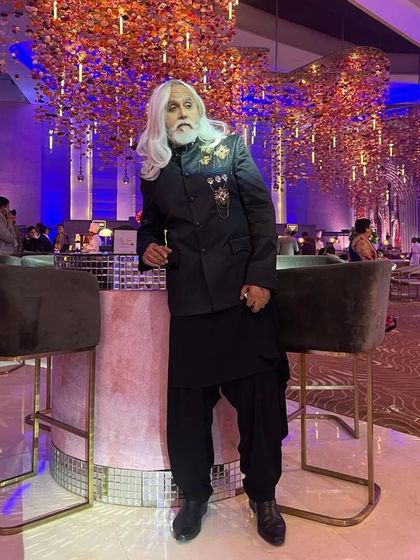 The renowned actor and model Dinesh Mohan looking stylish and confident. The makeup is subtle, enhancing his features for a sharp, camera-ready look.