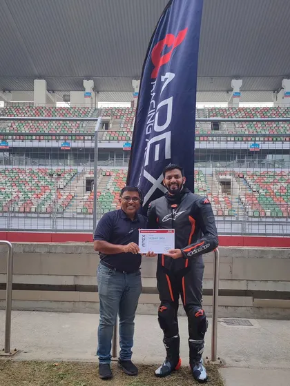 Earning your stripes. A proud moment for one of our riders, receiving his certificate after an intense and rewarding session at the Buddh International Circuit.