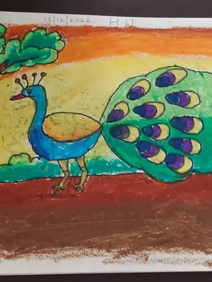 A beautiful peacock drawn by Rudransh, a 2nd standard student. He used oil pastels on paper to capture the vibrant colors of the peacock and its surroundings.