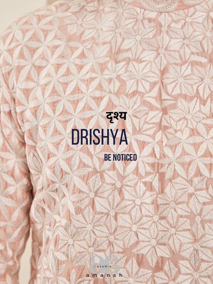 A close-up of the geometric embroidery on the blush pink kurta, with our brand motto.