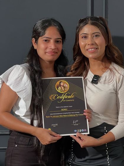 Presenting a newly certified makeup pro. I personally hand over each certificate because I am so invested in every student's journey.