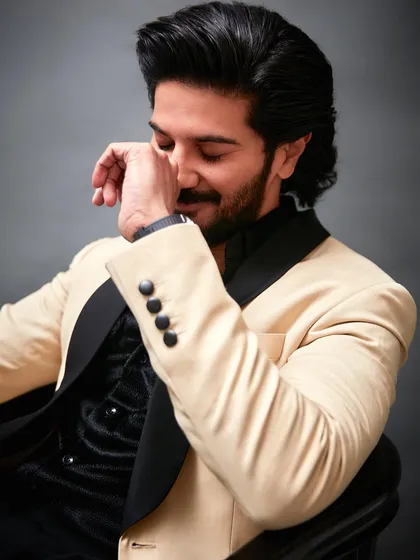 A candid moment with Dulquer Salmaan during the GQ shoot. Even in a moment of ease, the structure and elegance of the custom suit from Masculine Official remains impeccable.