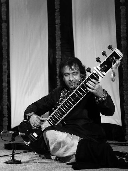 A black and white shot of Ustad Rafique Khan saheb during his sitar performance. My role as an accompanist is to provide the rhythmic canvas upon which the main artist paints their melody.