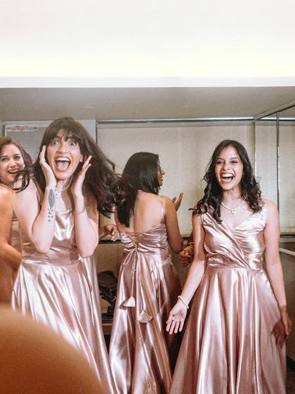 The bridesmaids' priceless reaction when they see the bride in her dress for the first time.