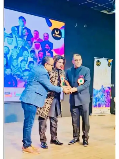 Receiving an award on stage at the Dubai Poetry Festival. These moments are a testament to the blessings of the Almighty and the love of my fans.