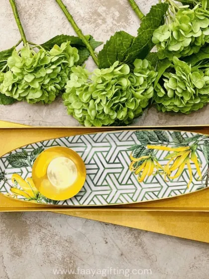 Add a touch of tropical charm to your home with our Borneo botanical chip and dip set. The geometric pattern combined with yellow florals makes it a unique and stylish gift for any occasion.