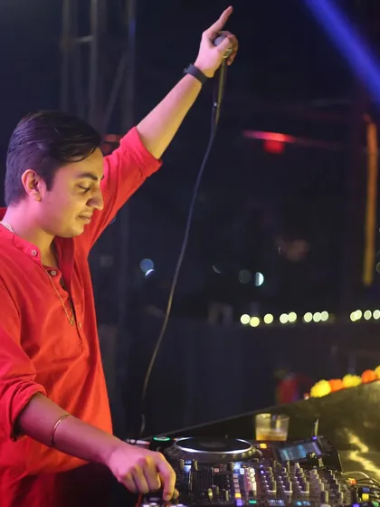 On the mic, leading the party. I am not just a DJ, I am an entertainer.