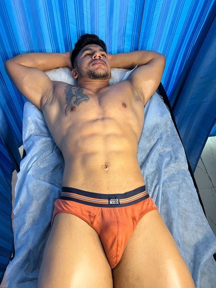 Wrestler Ashwani relaxing on the therapy bed after his session.