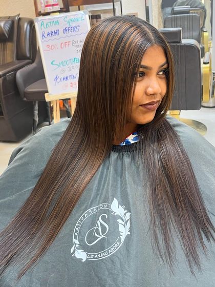 A combination of a hair botox treatment and highlights. The result is incredibly smooth, straight hair with beautiful, subtle dimension from the colour.