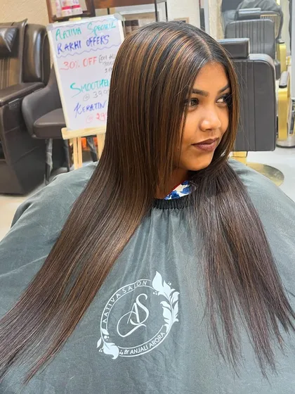 A combination of a hair botox treatment and highlights. The result is incredibly smooth, straight hair with beautiful, subtle dimension from the colour.