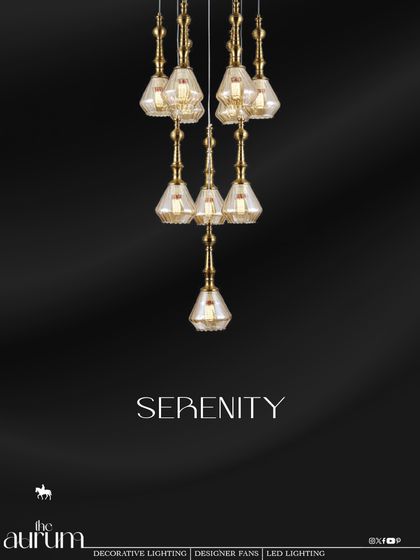 The 'Serenity' cluster pendant features elegant, diamond-cut glass shades. The cascading arrangement and warm gold finish create a sense of delicate luxury, perfect for a bedroom or a quiet corner.