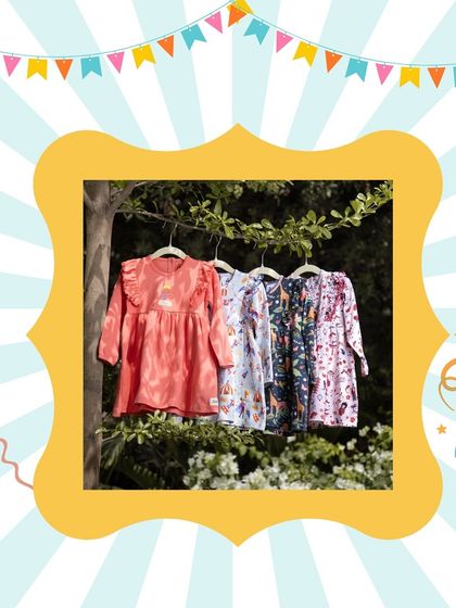A beautiful outdoor display of printed dresses for girls. I select brands that use quality materials and create charming, comfortable designs for everyday wear.