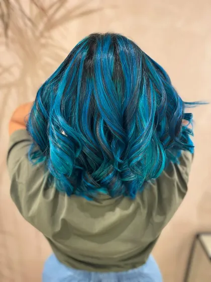 The back view of this mermaid blue bob. The color is multi-dimensional, with different shades of blue creating movement and depth.