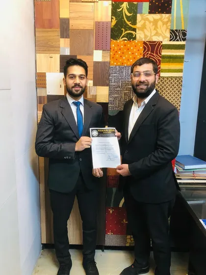Another successful intern is awarded his certificate. I ensure that every individual who completes the program is recognized for their dedication and effort.