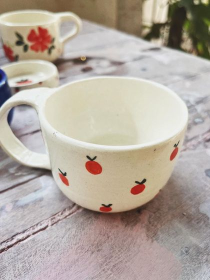 Look at the beautiful creations from this student who completed the intense potter's wheel course. Each piece is a masterpiece, adorned with colorful glazes and intricate, hand-painted details.