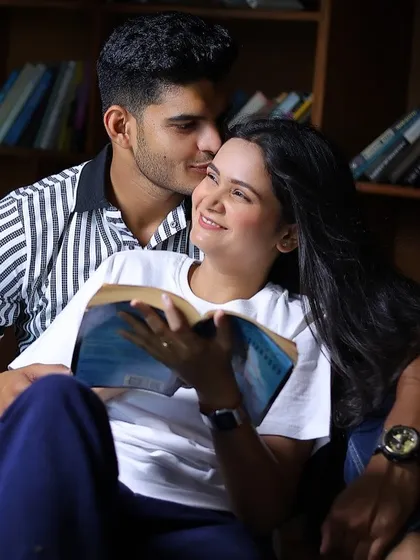 A candid, happy moment from a pre-wedding shoot in our indoor library set. This setup is designed to feel personal and intimate, perfect for capturing the natural connection between a couple.