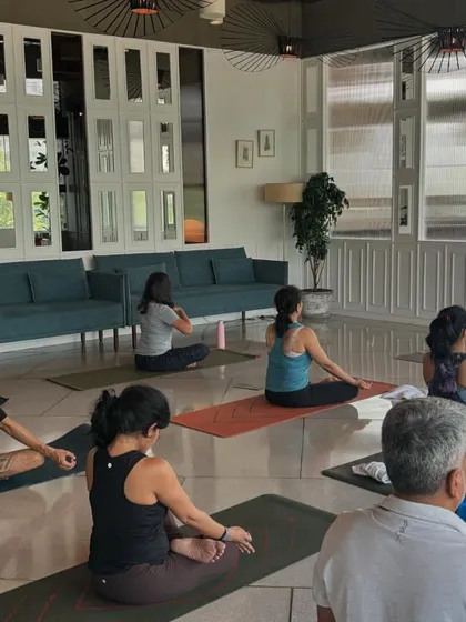 A class at The Quorum Club in Gurgaon, starting with a seated meditation to ground the energy before practice.
