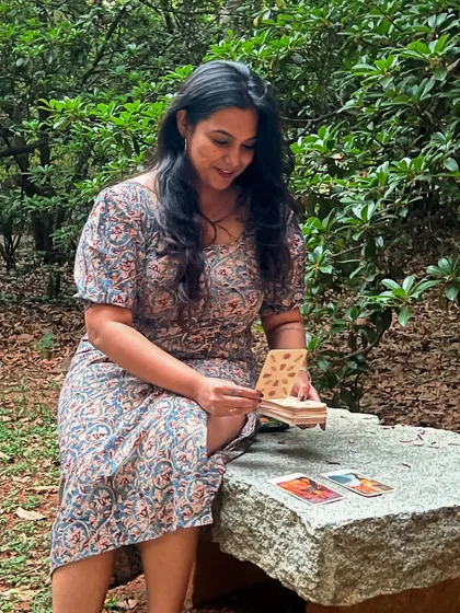 Another shot celebrating World Tarot Day. Here I am looking at the cards, fully absorbed in their story, surrounded by the peaceful energy of the outdoors.