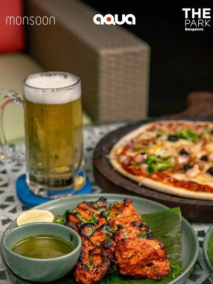 Tandoori chicken tikka and a wood-fired pizza, enjoyed with a mug of beer. It's the best of both worlds at Aqua and Monsoon.