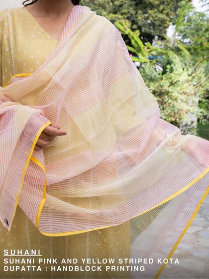 This Suhani pink and yellow striped Kota dupatta is a beautiful example of hand-block printing. The light, airy fabric and cheerful colors make it a versatile piece for any wardrobe.