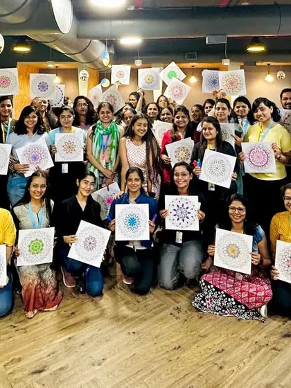 The joy and happiness in this photo say it all. A group of employees from a corporate client, rejuvenated after a session of connecting with their creative side.
