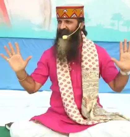 Guiding participants through a breathing exercise. The hands are held open as a gesture of receiving universal energy. Simple practices like this can have a profound impact on our state of being.