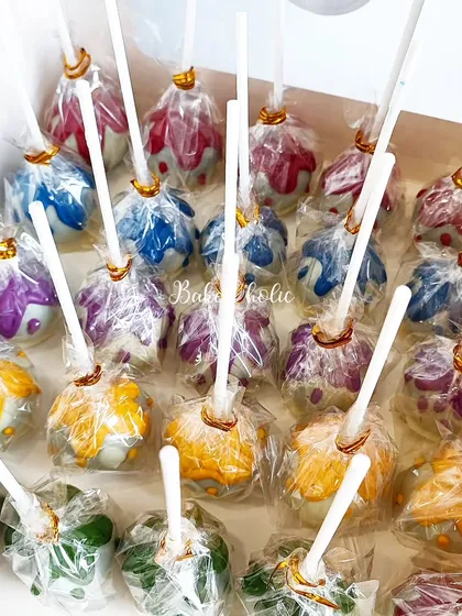 I love bringing a party theme to life, like with these colorful cake pops for a paint-themed celebration. Each pop is a bite-sized treat, individually wrapped and designed to perfectly match your dessert table decor.