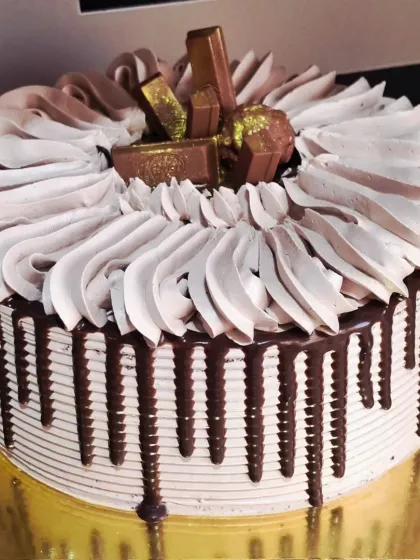 My loaded chocolate drip cake is a bestseller for a reason. This eggless truffle cake is covered in rich chocolate ganache and topped with favorites like KitKat and Ferrero Rocher, making it a dream come true for any chocolate lover.