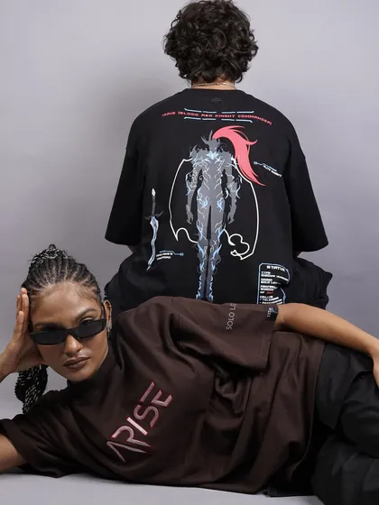 A creative, layered pose with two models, showcasing different pieces from the streetwear collection. This type of shot is great for showing how the collection can be styled together.