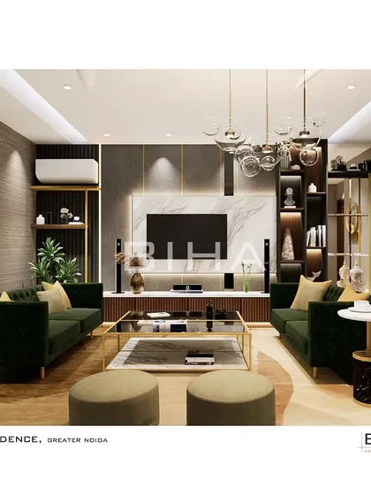 In this contemporary living room for a Greater Noida residence, we focused on creating a sophisticated entertainment and social hub. A marble-clad media wall is flanked by custom shelving with integrated lighting to display art and decor. The deep green velvet sofas add a rich texture and color, grounded by a sleek, multi-level coffee table.
