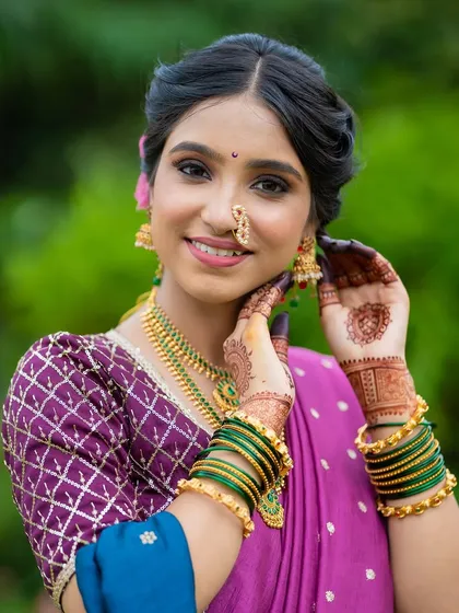 A symphony of tradition and grace. For this look, I used soft, dusky tones on the eyes and a rose-tinted lip to create a poetic and timeless elegance that honors her heritage.