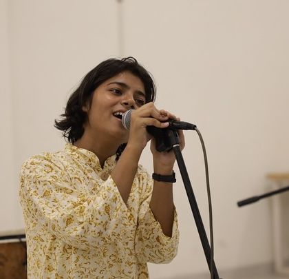 A solo vocalist lost in the music. The Seekho Showcase is a space where individual artists can truly shine and connect with the audience through their performance.