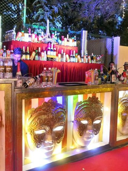 A full view of our stylish mocktail bar. The illuminated masks create a unique and festive ambiance, perfect for an engagement party or sangeet.