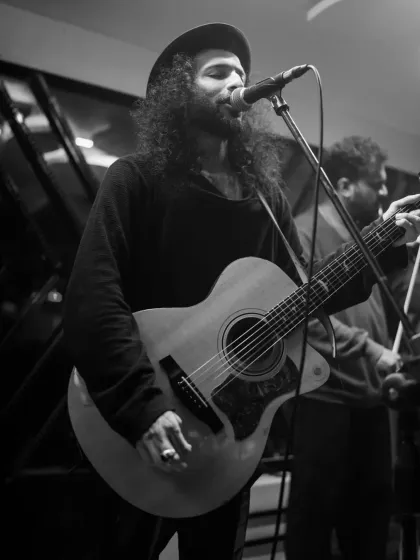 A guitarist performing as part of the live fusion experience. These collaborations are perfect for sangeets, corporate events, or any party that wants something extra special.