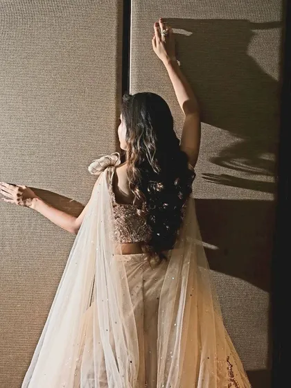 Beautifully styled hair is just as important as the makeup. Here, we created soft, romantic curls to complete the bride-to-be's engagement look.