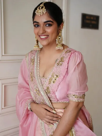 The smile of a happy Punjabi bride. Her makeup is kept bright and luminous to match the celebratory feel of her Anand Karaj ceremony.