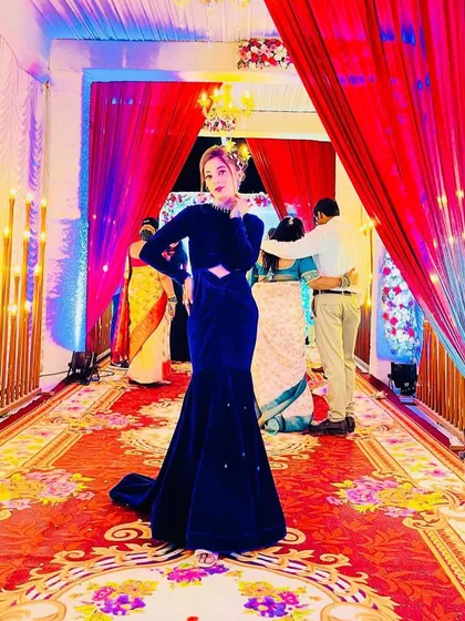 For a glamorous evening event, I created this royal blue velvet mermaid gown. The design features a modern cut-out waist and a long train, making it a true statement piece for any wedding or reception.