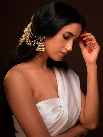 Another angle from this series, showing the beautiful hair accessory and the graceful line of the shoulder.