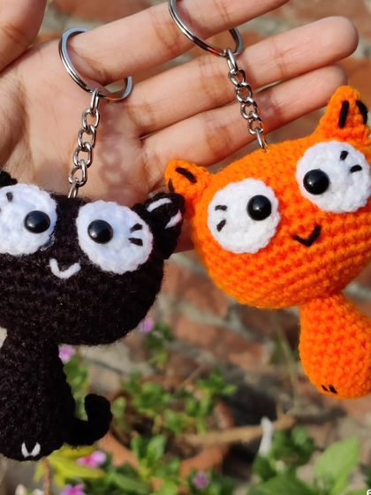 My quirky kitty keychains are for all the cat lovers out there. I make them in black and orange, with options for heart-shaped patches or wide-eyed expressions.