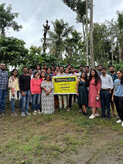 Our Wayanad group with their banner, ready to explore.