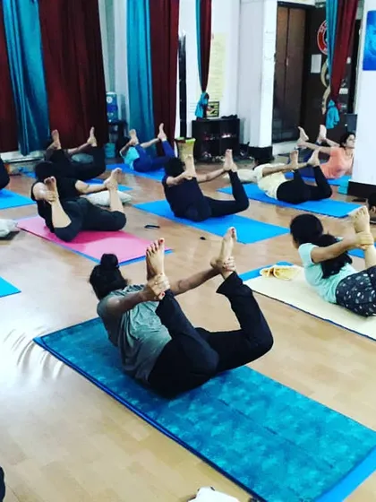 The class works together on Dhanurasana (Bow Pose). This energizing backbend strengthens the back muscles, improves posture, and opens up the chest and shoulders.