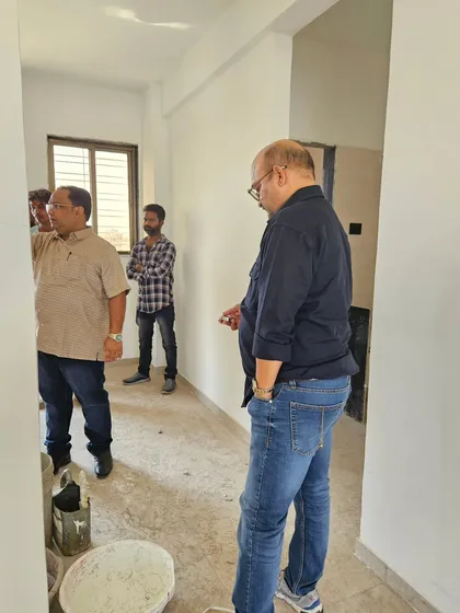 Inspecting a hallway in a client's home. Even transitional spaces need to have a clear and positive energy flow to connect the rooms harmoniously.