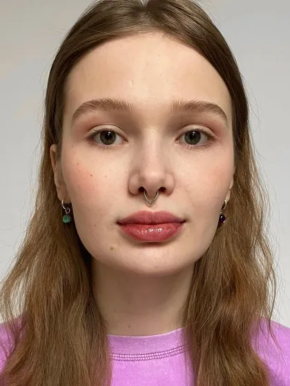 A happy client after her eyebrow service. Our training emphasizes not just technique, but also how to ensure your client leaves feeling confident and beautiful.