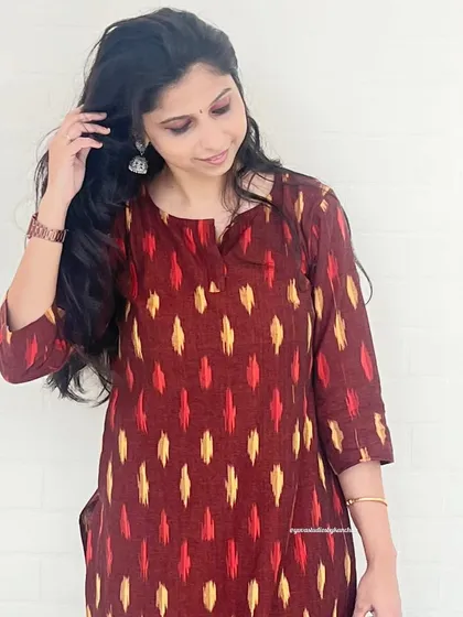 A closer look at the beautiful maroon and yellow patterns of this handloom Ikat kurta. Each piece is handcrafted with care, making it a unique addition to your wardrobe.