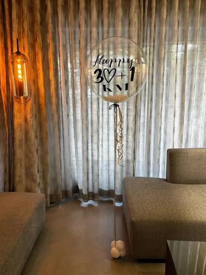 A chic and simple way to celebrate a 31st birthday. This personalized '30+1' bubble balloon is perfect for an elegant, low-key celebration at home.